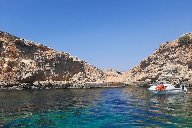 Boat Charters Blue lagoon, Crystal Lagoon, Comino, Malta 4hr trip - Saint Mary’s Tower and the prison from a film