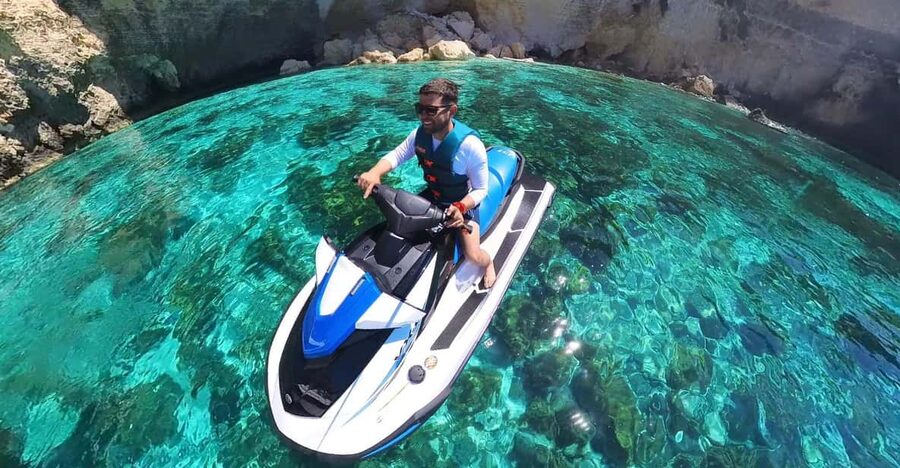 From Mellieħa: Comino, Blue Lagoon, and Gozo Jet Ski Tour - Following the guide across Comino’s coast