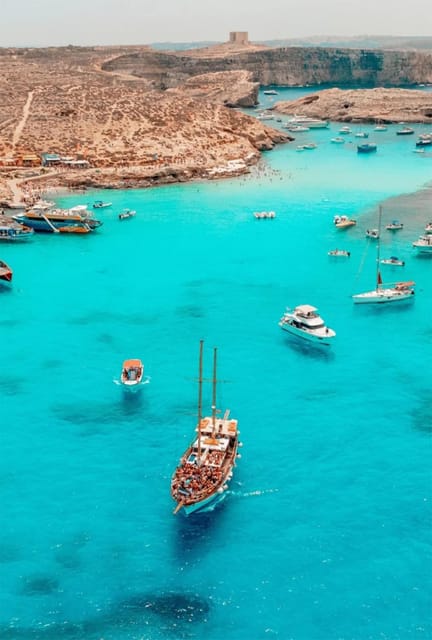 Malta: Boat Party + Watersport+ Comino+ OpenBar ALL INCLUDED - Returning at sunset with Popeye Village in view