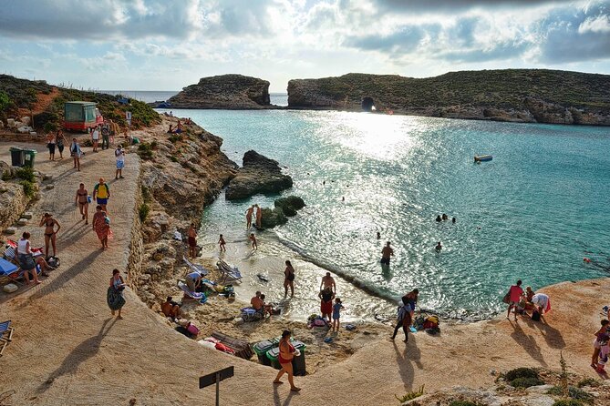 Malta Sunset Boat Tour: Bugibba to Comino Blue Lagoon Cruise - The 10-meter slide and swimming from the boat