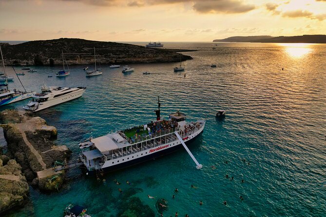 Malta Sunset Boat Tour: Bugibba to Comino Blue Lagoon Cruise - Cruising past St. Paul’s Island and Malta’s northern coast