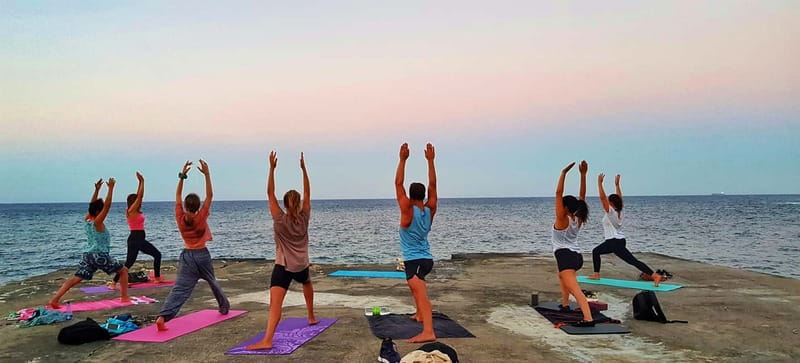 Sliema: Beach Yoga Class with Swimming - Strength, flexibility, and a personal pace