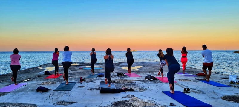 Sliema: Beach Yoga Class with Swimming - Sunrise or sunset: choosing the better session