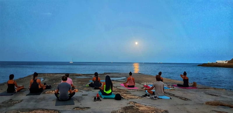 Sliema: Beach Yoga Class with Swimming - Sun salutations and steady movement