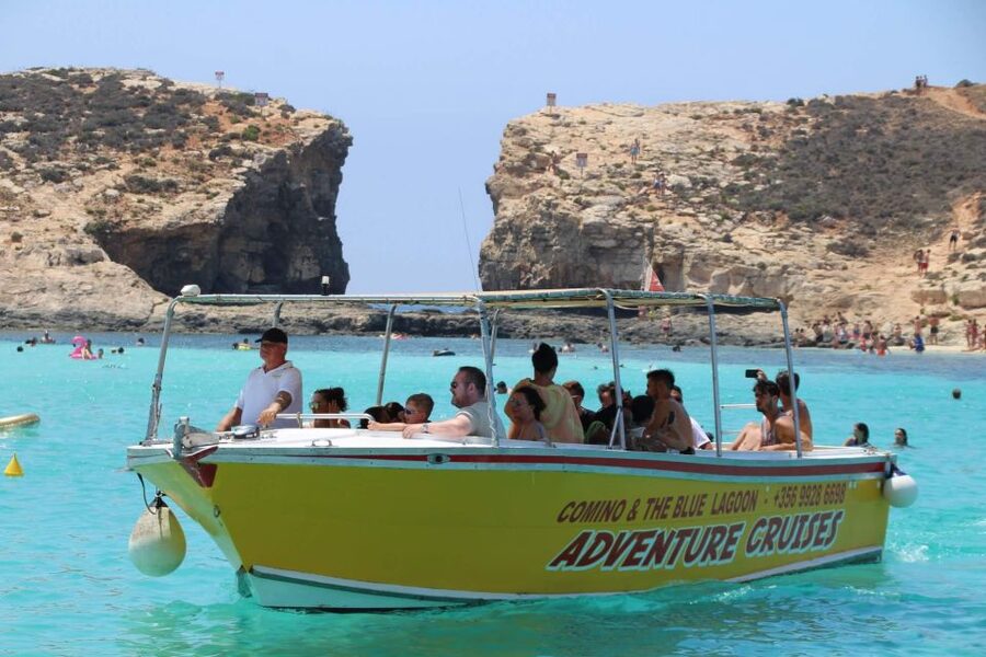 Sliema: Boat Trip to Comino Blue Lagoon, Gozo, and Caves - Crystal Lagoon: the first swim from the boat