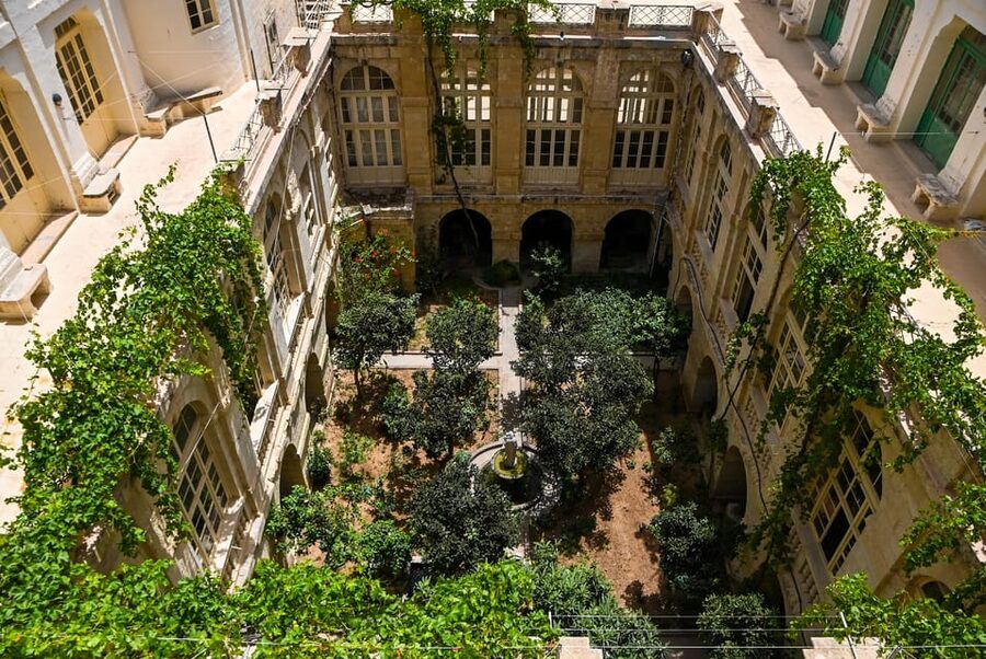 Valletta: Monastery and Secret Garden Entry Ticket - Crossing from Valletta’s streets into a cloistered home